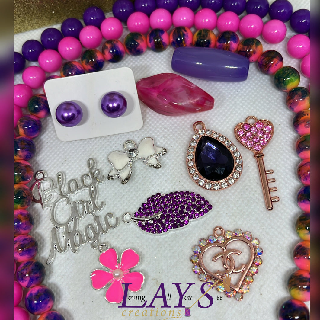 Pink and purple bead, and charm bundle set